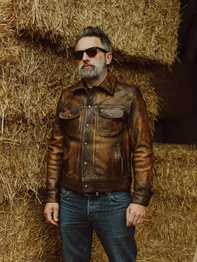 The Masterpiece “Terracotta” Deserto Leather Jacket.

Inspired by late 60s Western jackets and revisited with a unique Italian touch, the “Terracotta” Deserto Leather Jacket represents an authentic garment made of vegetable tanned full grain Lambskin from Tuscany (Italy) with “Deserto” Treatment, and “Espresso Coffee” color viscose lining.

The “Deserto” Treatment is entirely made by hand by Italian Artisans. Starting from selected Natural Veg Tanned Raw Hides, the Leather has been Dyed, Soaked, Brushed and Distressed to give it a real antique worn look.
The Color Shades go from the bright Sand to the darker Ebony, passing trough a various shades of Tan and Dust tones.

The process of distressing leather doesn’t just make it look worn, but it also makes it more Durable and Strong, lasting over time.

The attention to detail makes it a rare and authentic leather jacket Hand Made in Italy.

Designed for Bikers, Rockers and Gentlemen.

Any imperfections or variations in color, texture or grain are not to be considered as defects, but distinctive elements of a unique, artisanal quality product.

This is a “1 of 1 piece” exclusive to you.

Proudly Hand Made in Italy